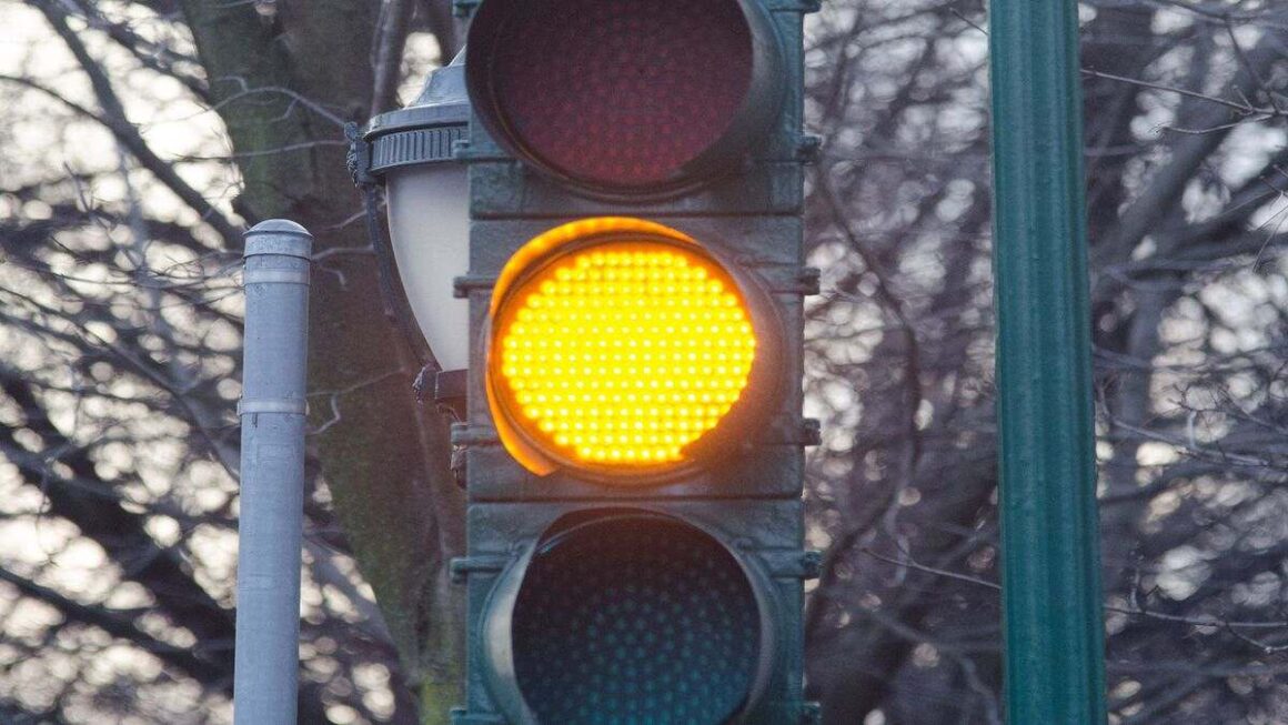 Image showing traffic signal with yellow light on