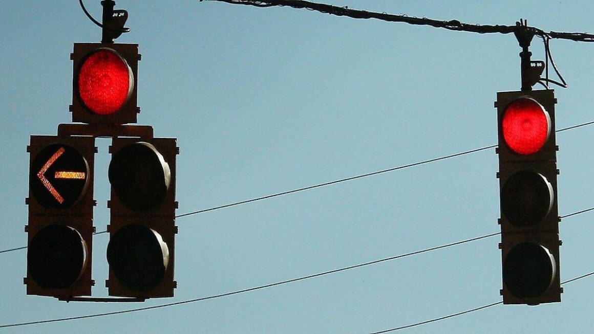 Image showing traffic signal with red light and left red arrow on